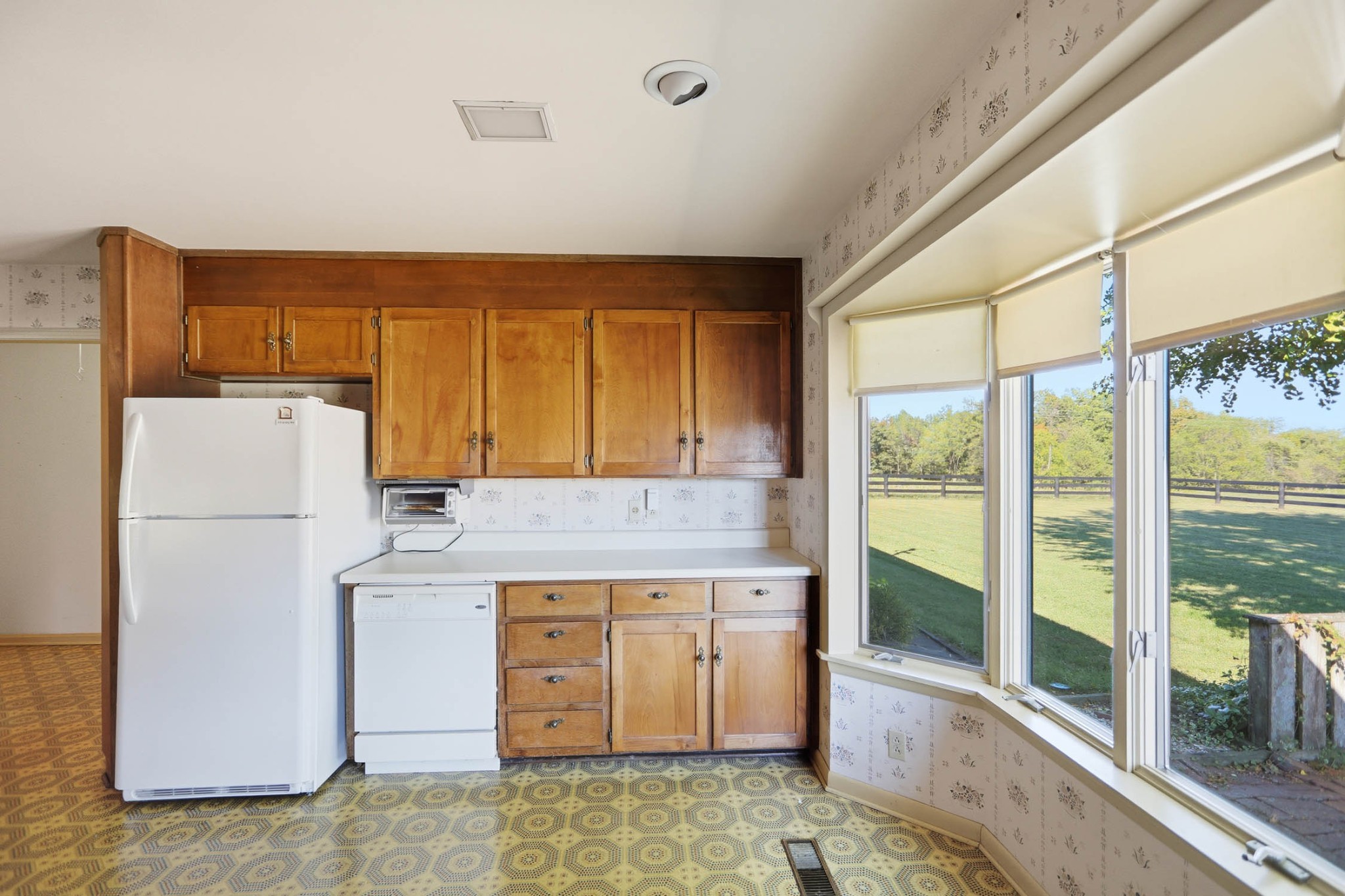 4231 Airport Road Springfield, TN 37172 - Photo 10 of 39 a kitchen that has a fridge and a stove in it