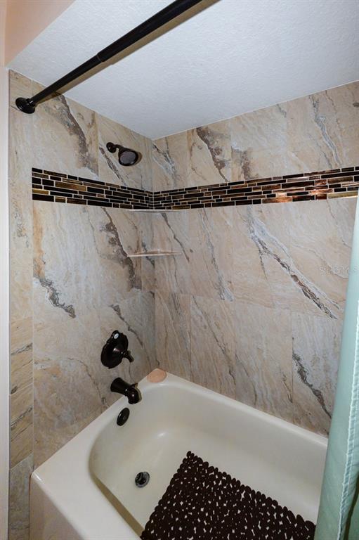 335 Coldeway Drive, Unit F21 Punta Gorda, FL 33950 - Photo 22 of 45 a bathroom with a bathtub