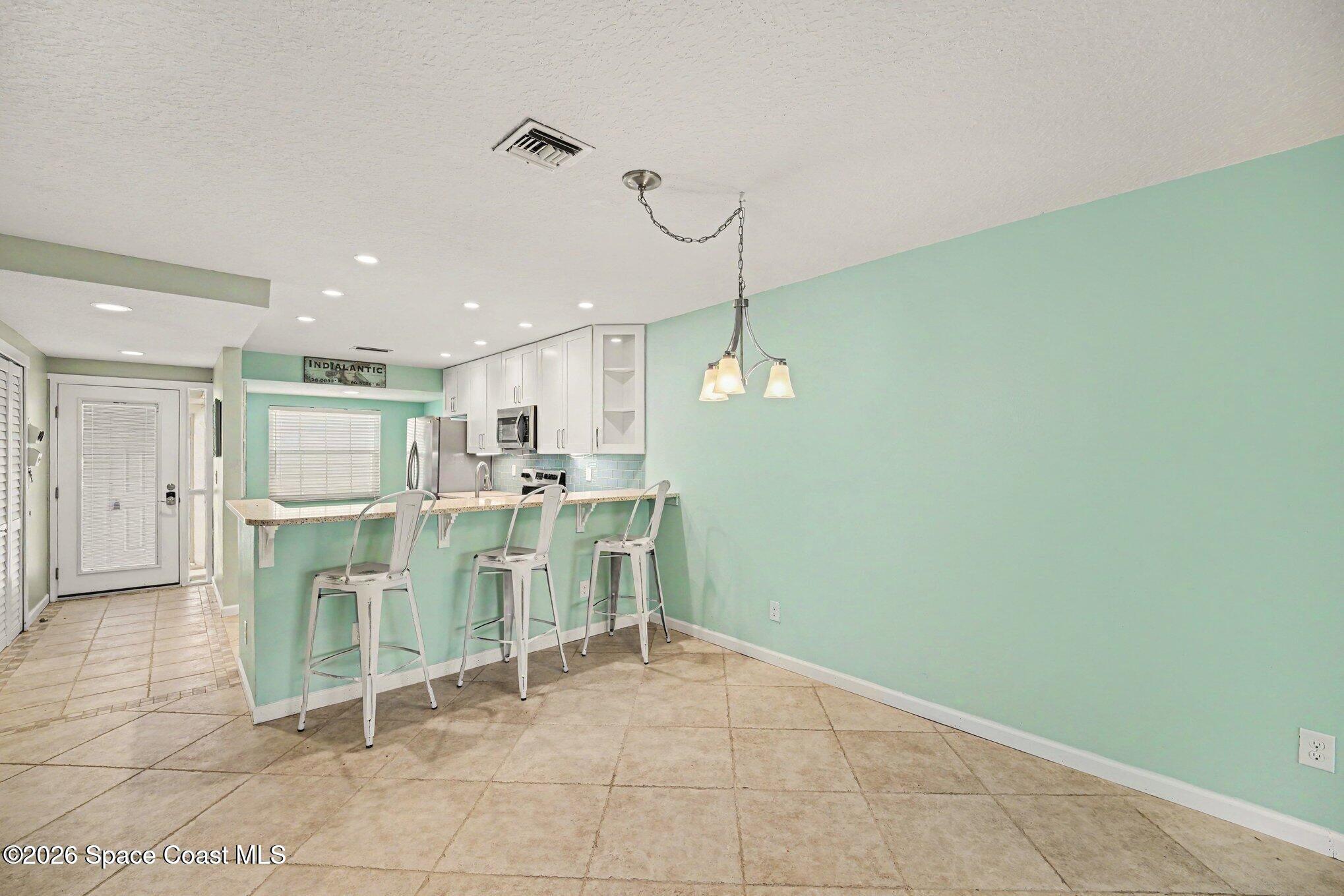 290 Paradise Boulevard, Unit 2 Indialantic, FL 32903 - Photo 2 of 20 Kitchen & Main room