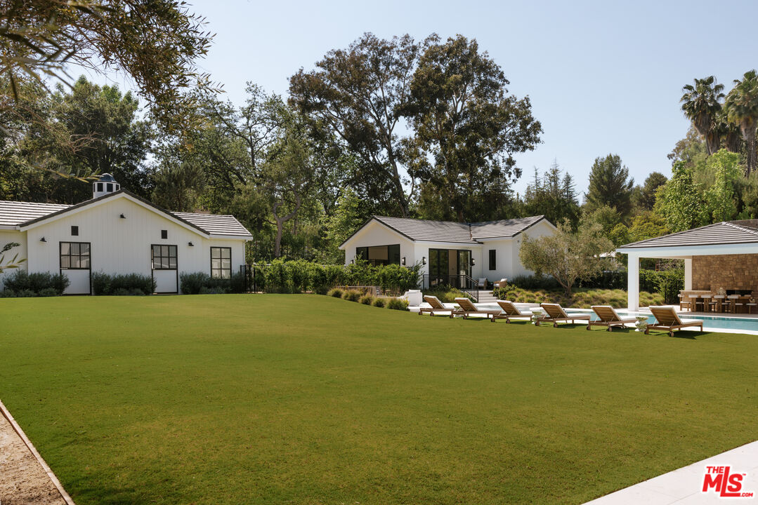 24640 Wingfield Road Hidden Hills, CA 91302 - Photo 12 of 34 a front view of house with yard and trees