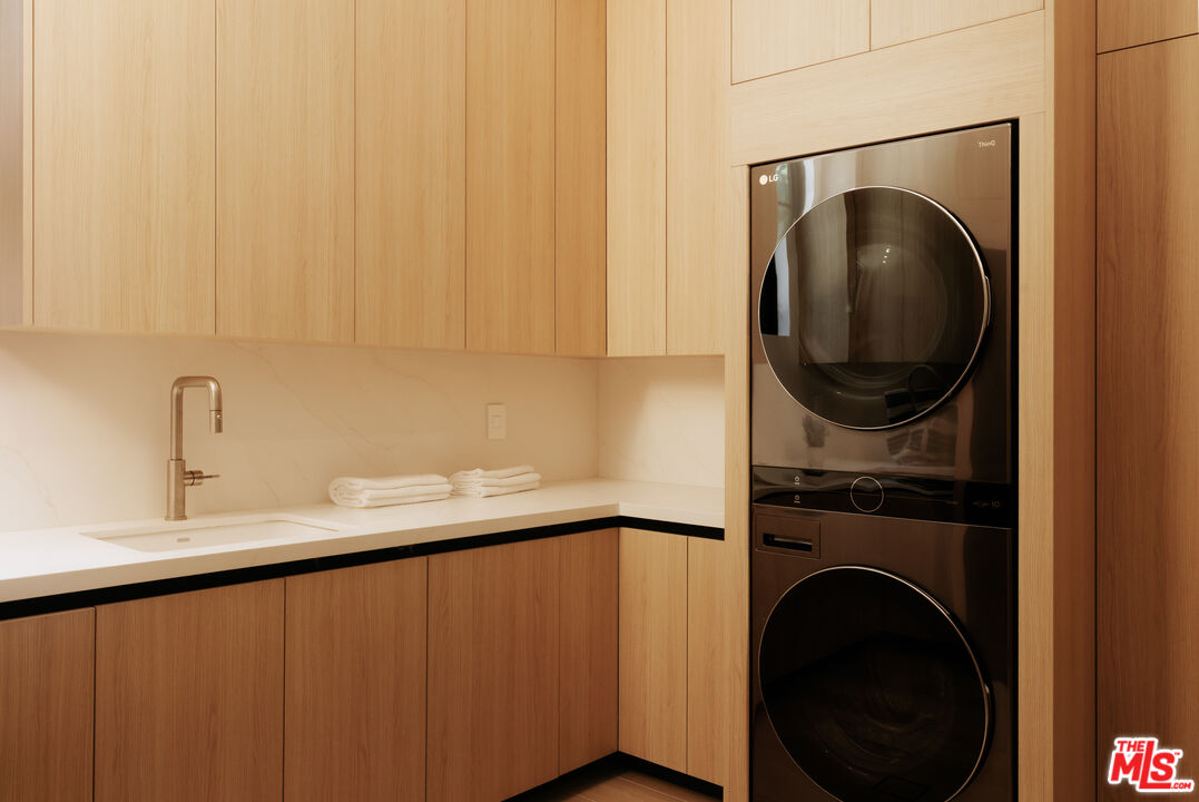 24640 Wingfield Road Hidden Hills, CA 91302 - Photo 17 of 34 a utility room with sink dryer and washer