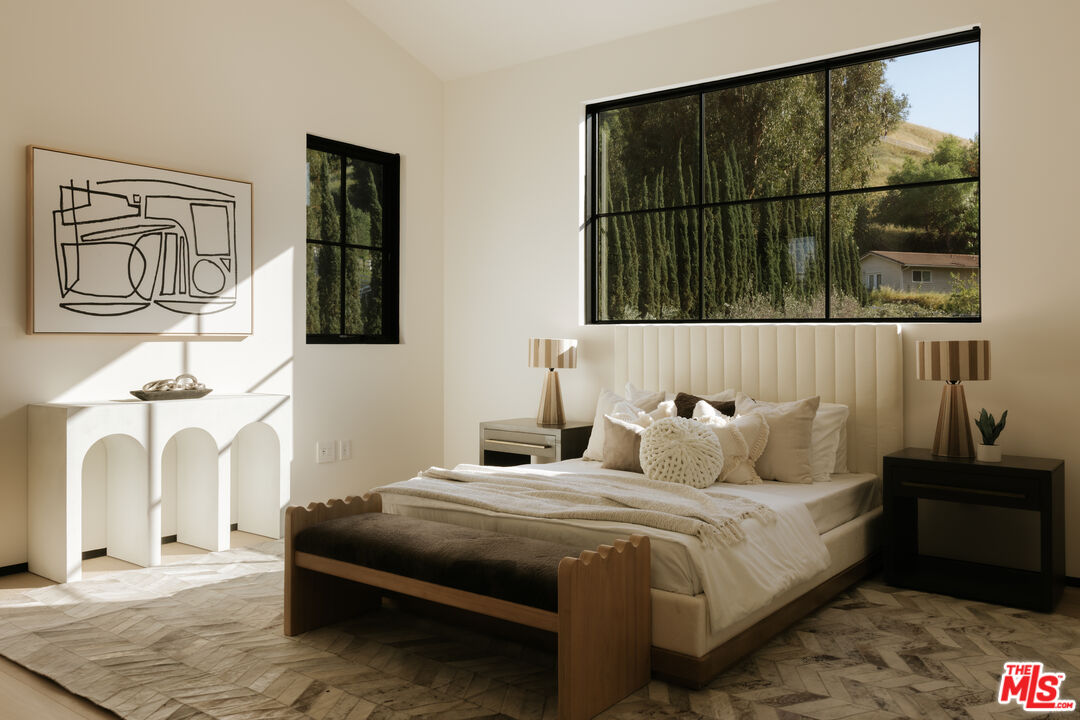 24640 Wingfield Road Hidden Hills, CA 91302 - Photo 27 of 34 a bedroom with a bed and a window