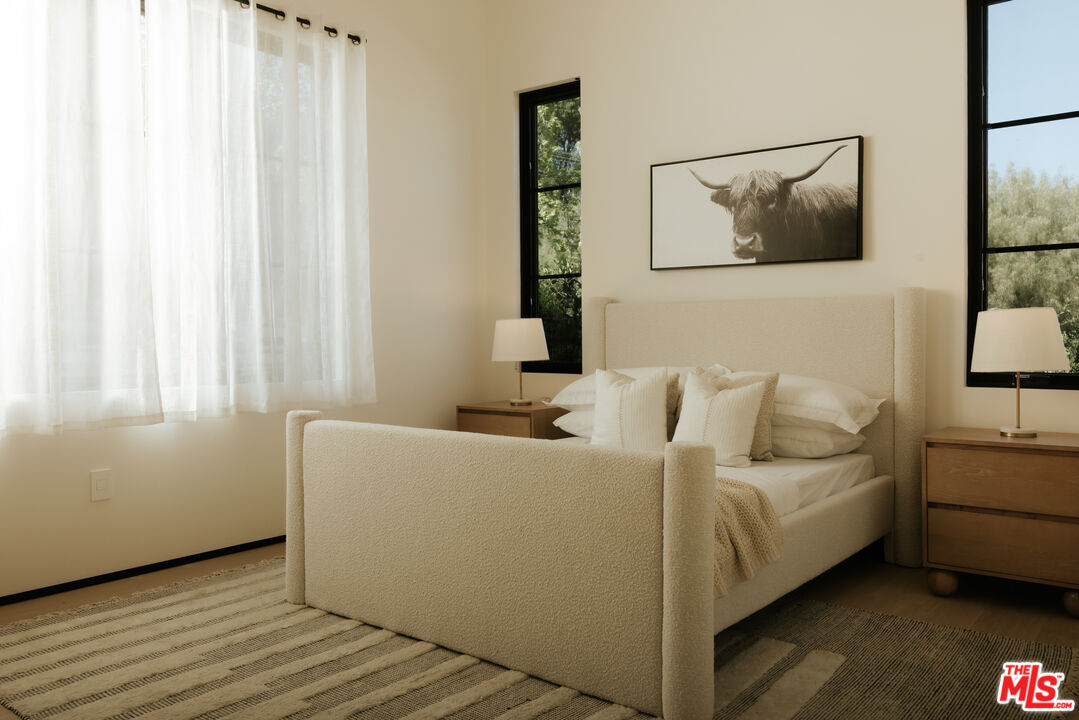 24640 Wingfield Road Hidden Hills, CA 91302 - Photo 32 of 34 a living room with furniture and a window