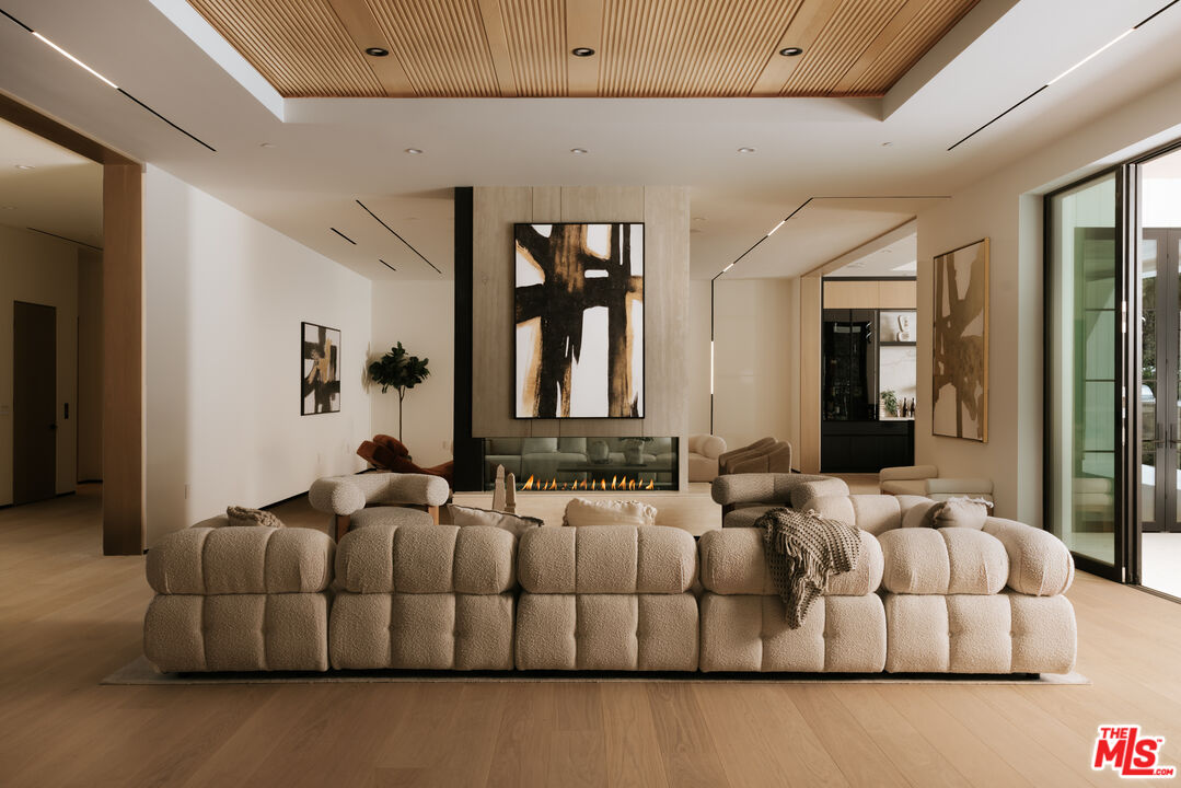 24640 Wingfield Road Hidden Hills, CA 91302 - Photo 10 of 34 a living room with furniture and large window