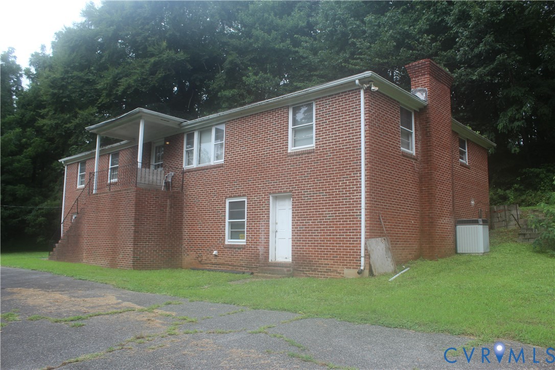 12642 Hull Street Road Midlothian, VA 23112 - Photo 1 of 1 a front view of a house with garden