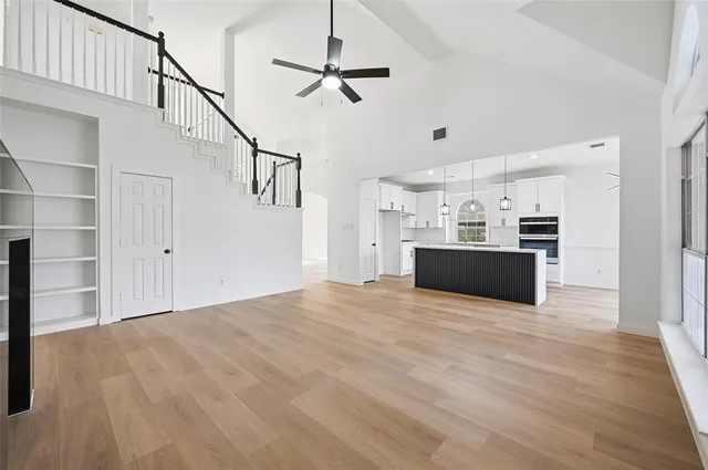 a view of a kitchen with microwave and cabinets