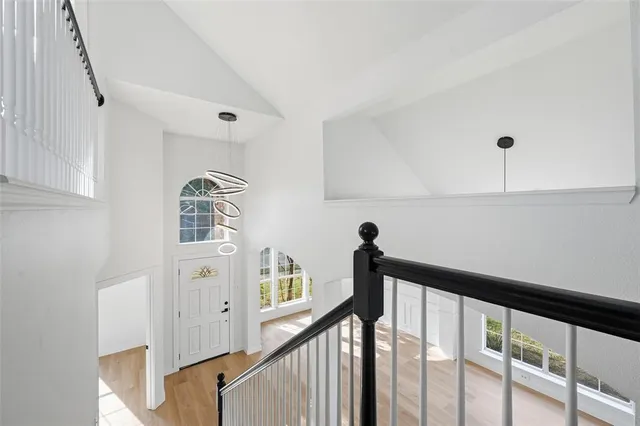a view of a hallway with window and stairs