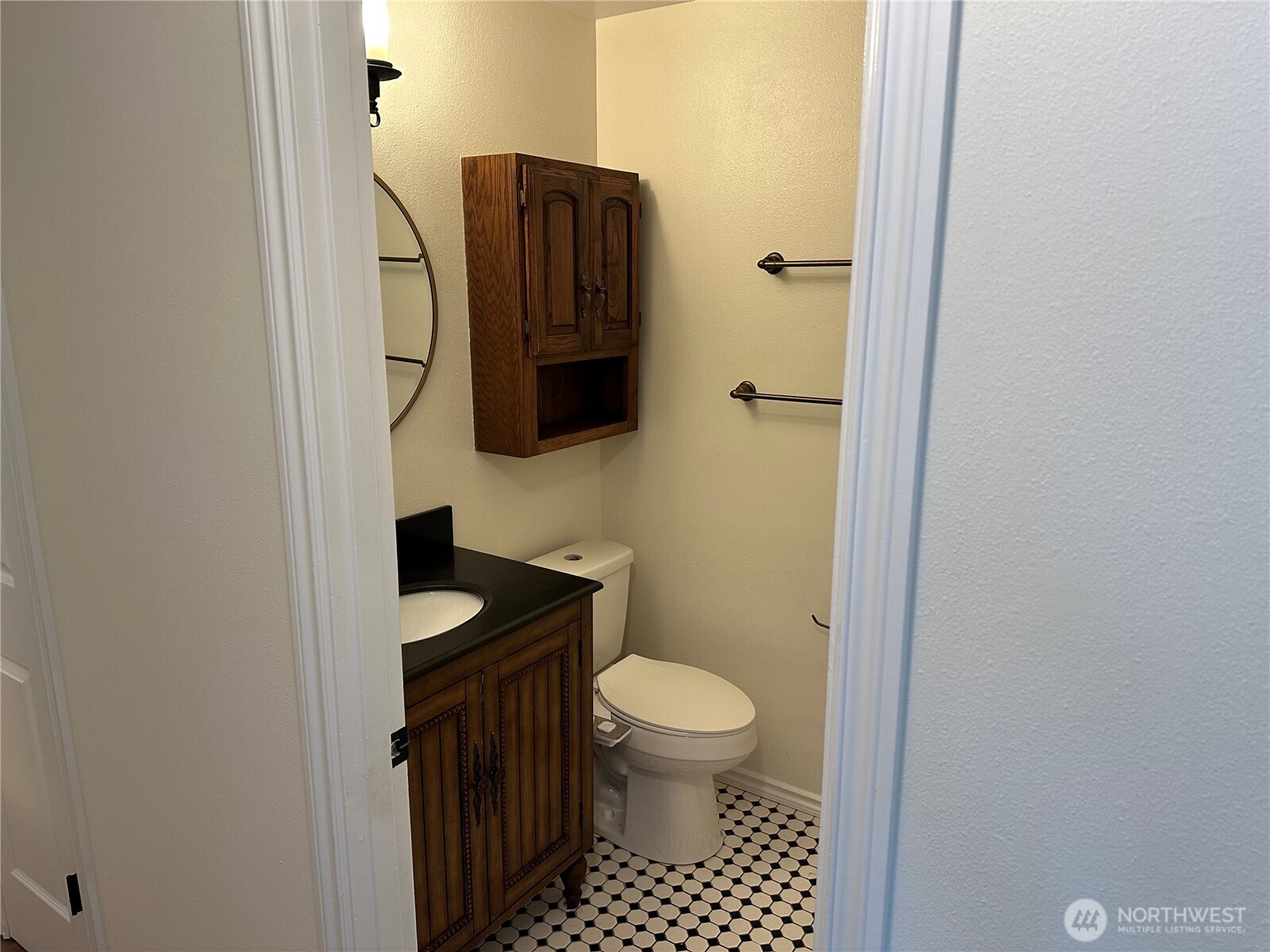 21923 3rd Place West Bothell, WA 98021 - Photo 14 of 19 a bathroom with a toilet a sink and mirror