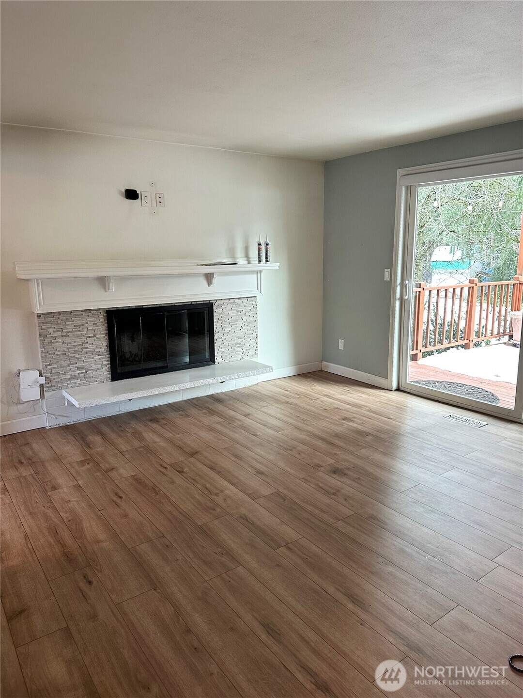 21923 3rd Place West Bothell, WA 98021 - Photo 3 of 19 a view of empty room with wooden floor and fireplace