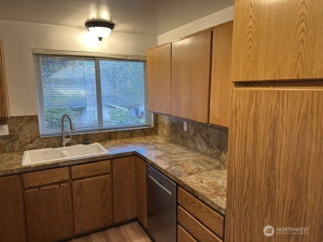 21923 3rd Place West Bothell, WA 98021 - Photo 9 of 19 a bathroom with a granite countertop sink and a mirror