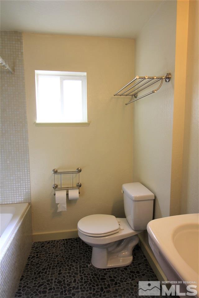 2005 Watt Street Reno, NV 89509 - Photo 22 of 29 a white toilet sitting next to a white tub
