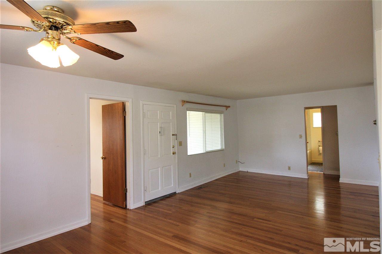 2005 Watt Street Reno, NV 89509 - Photo 8 of 29 an empty room with wooden floor and windows