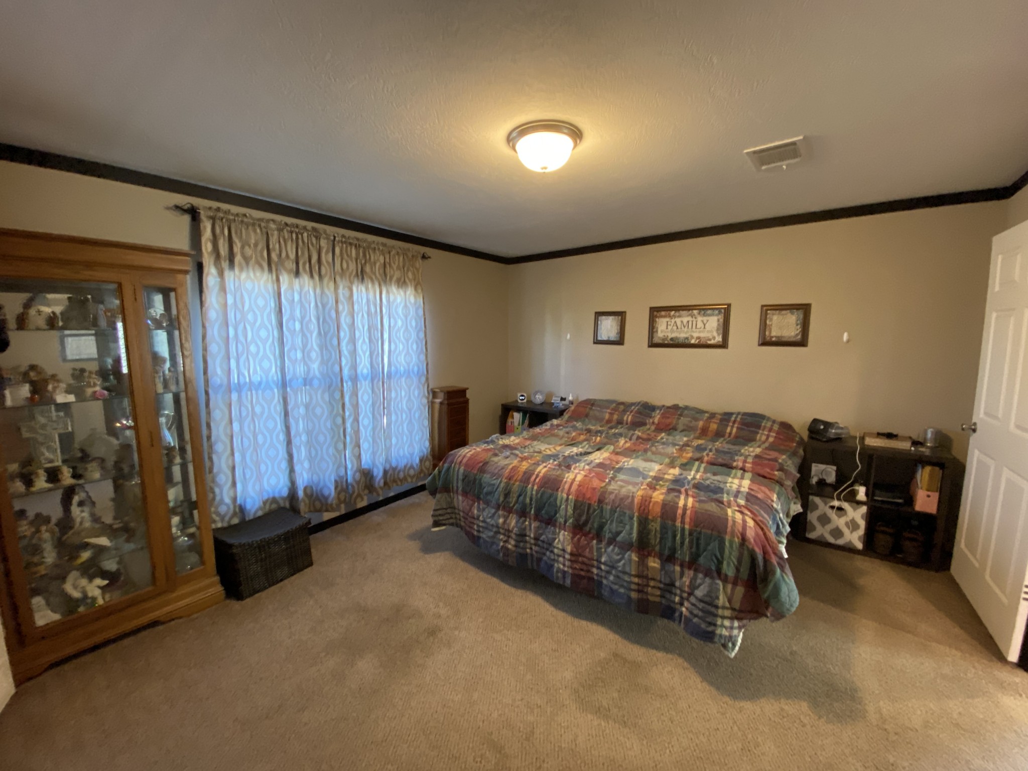 255 Rascal Town Road Loretto, TN 38469 - Photo 15 of 54 a spacious bedroom with a bed and a table