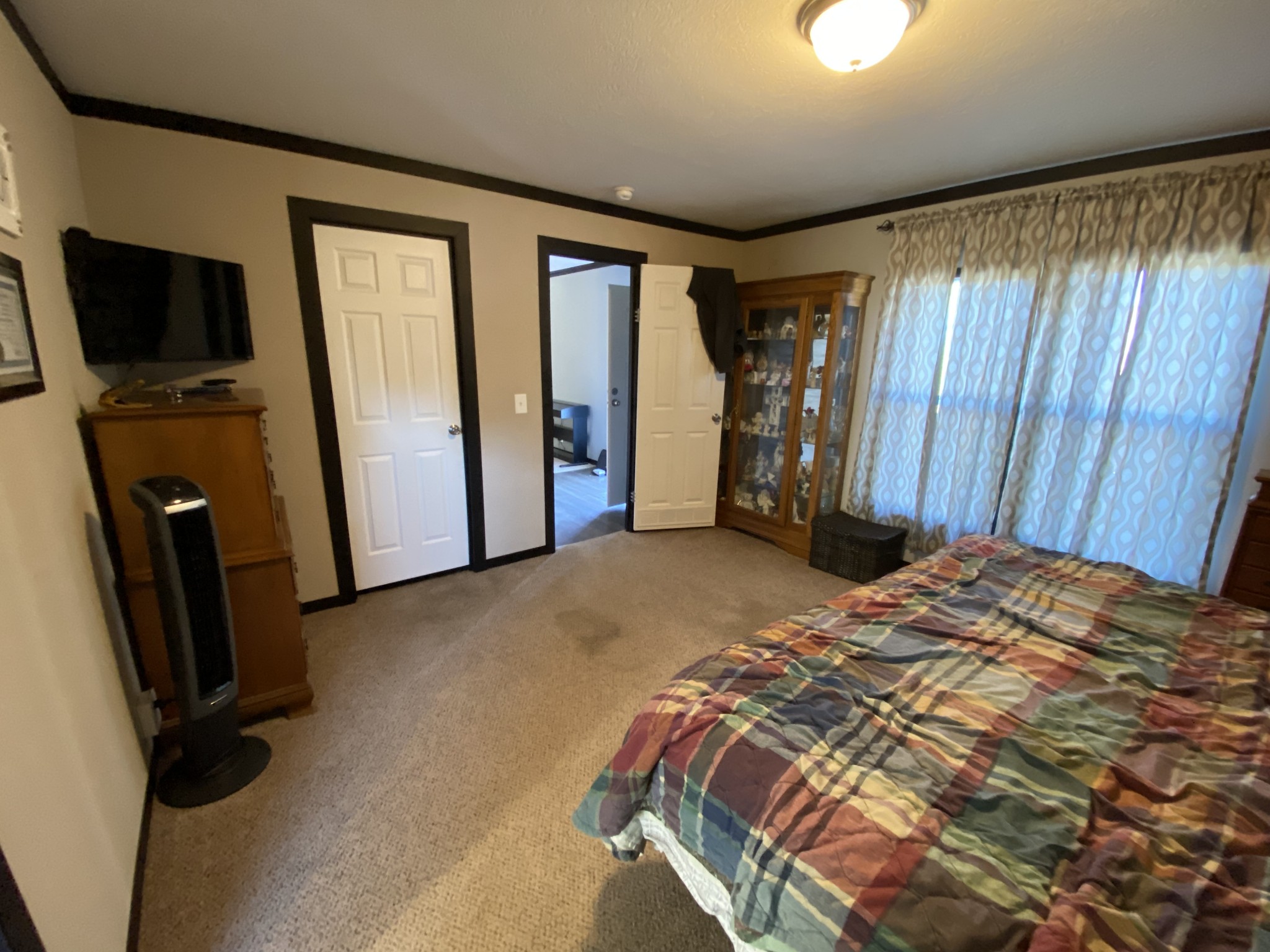255 Rascal Town Road Loretto, TN 38469 - Photo 16 of 54 a bed sitting in a room next to a window