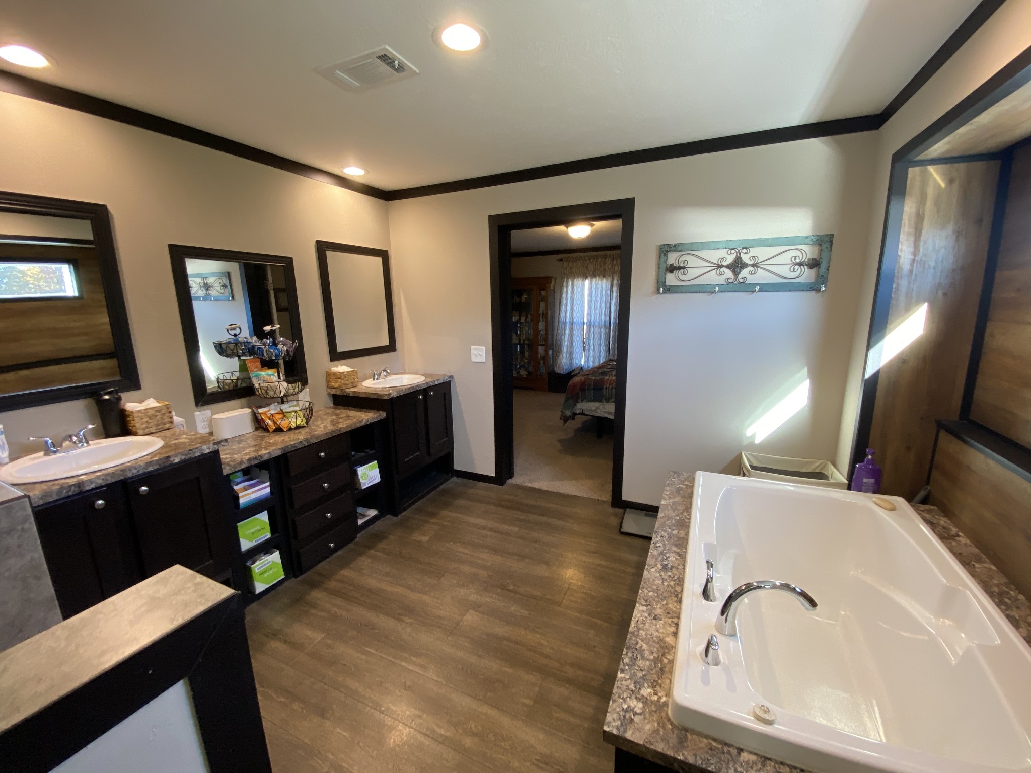 255 Rascal Town Road Loretto, TN 38469 - Photo 21 of 54 a spacious bathroom with a double vanity sink and a mirror
