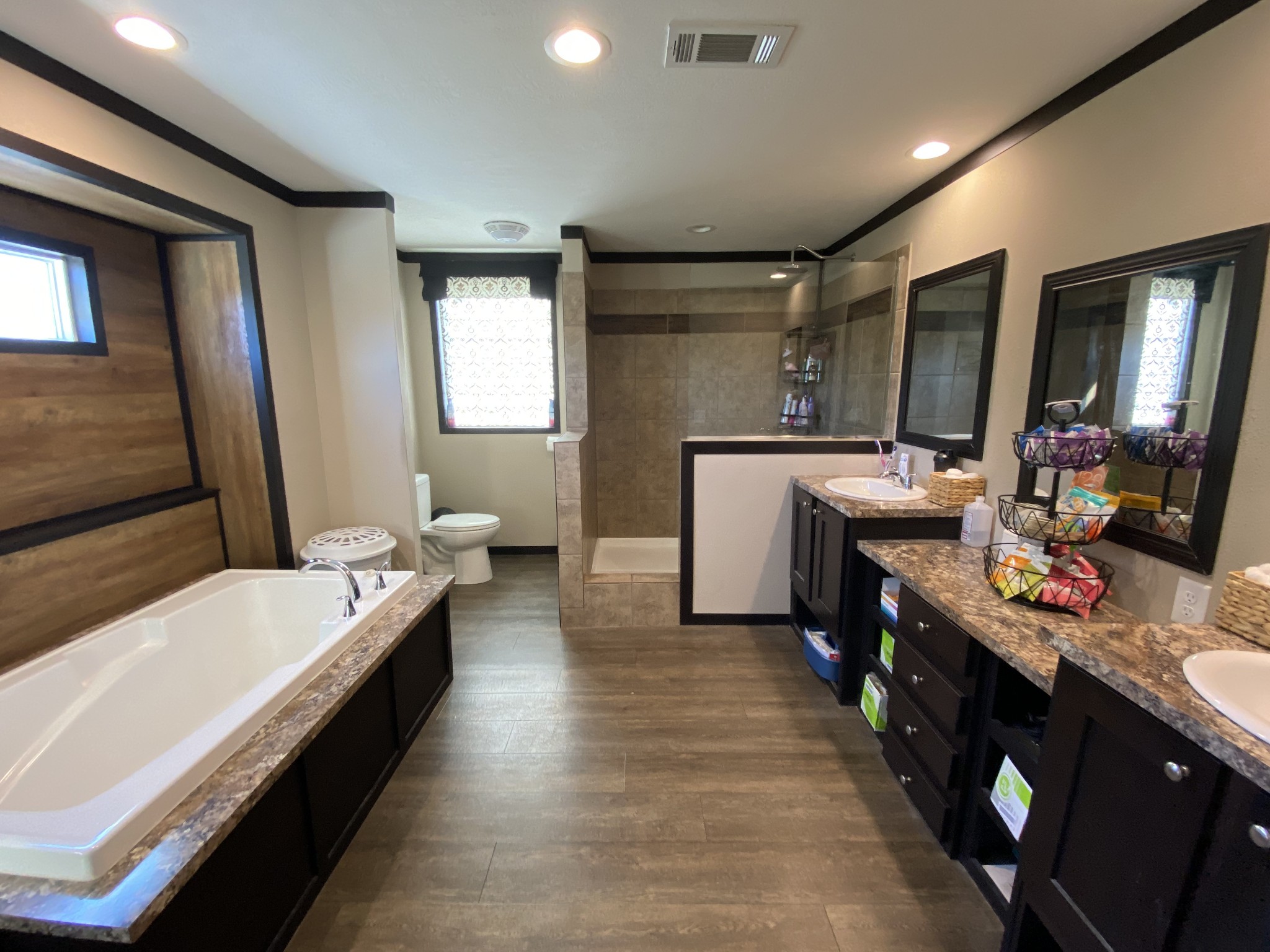 255 Rascal Town Road Loretto, TN 38469 - Photo 22 of 54 a bathroom with a tub sink and mirror