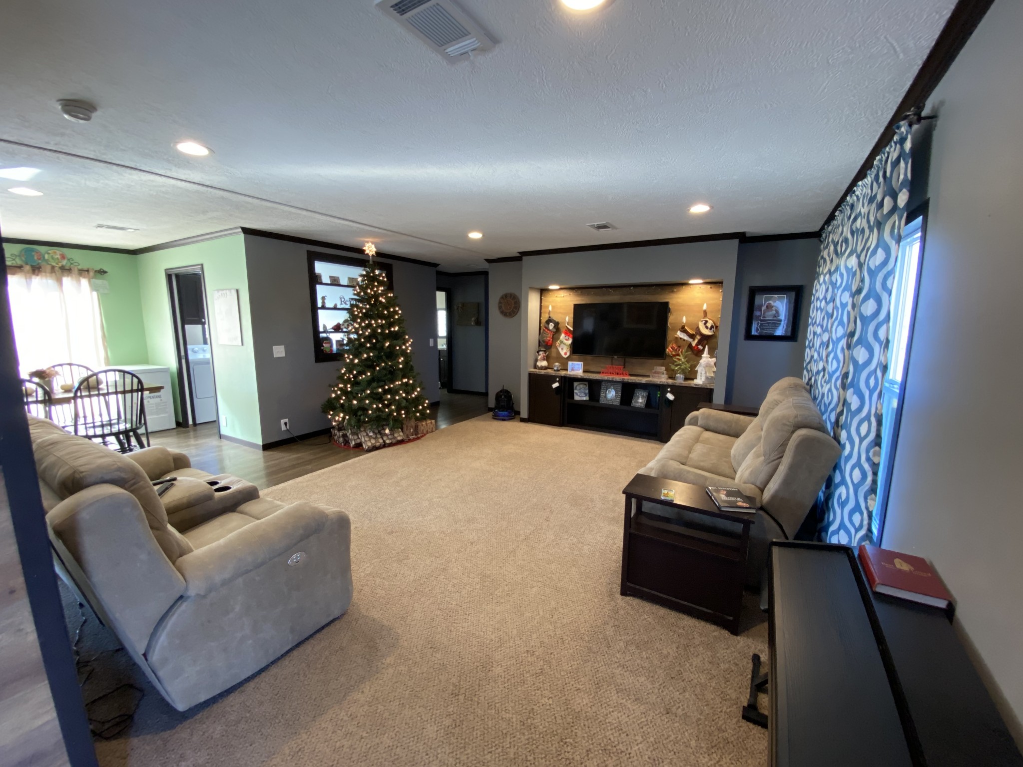 255 Rascal Town Road Loretto, TN 38469 - Photo 25 of 54 a living room with furniture and a flat screen tv