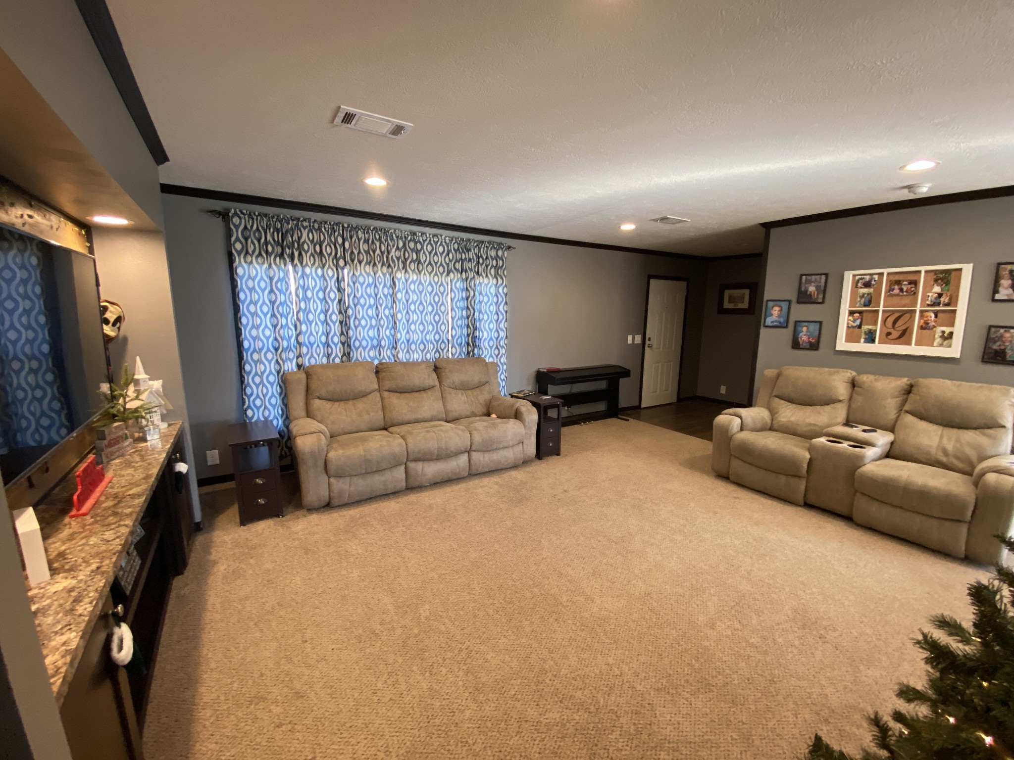 255 Rascal Town Road Loretto, TN 38469 - Photo 26 of 54 a living room with furniture gym equipment and a flat screen tv