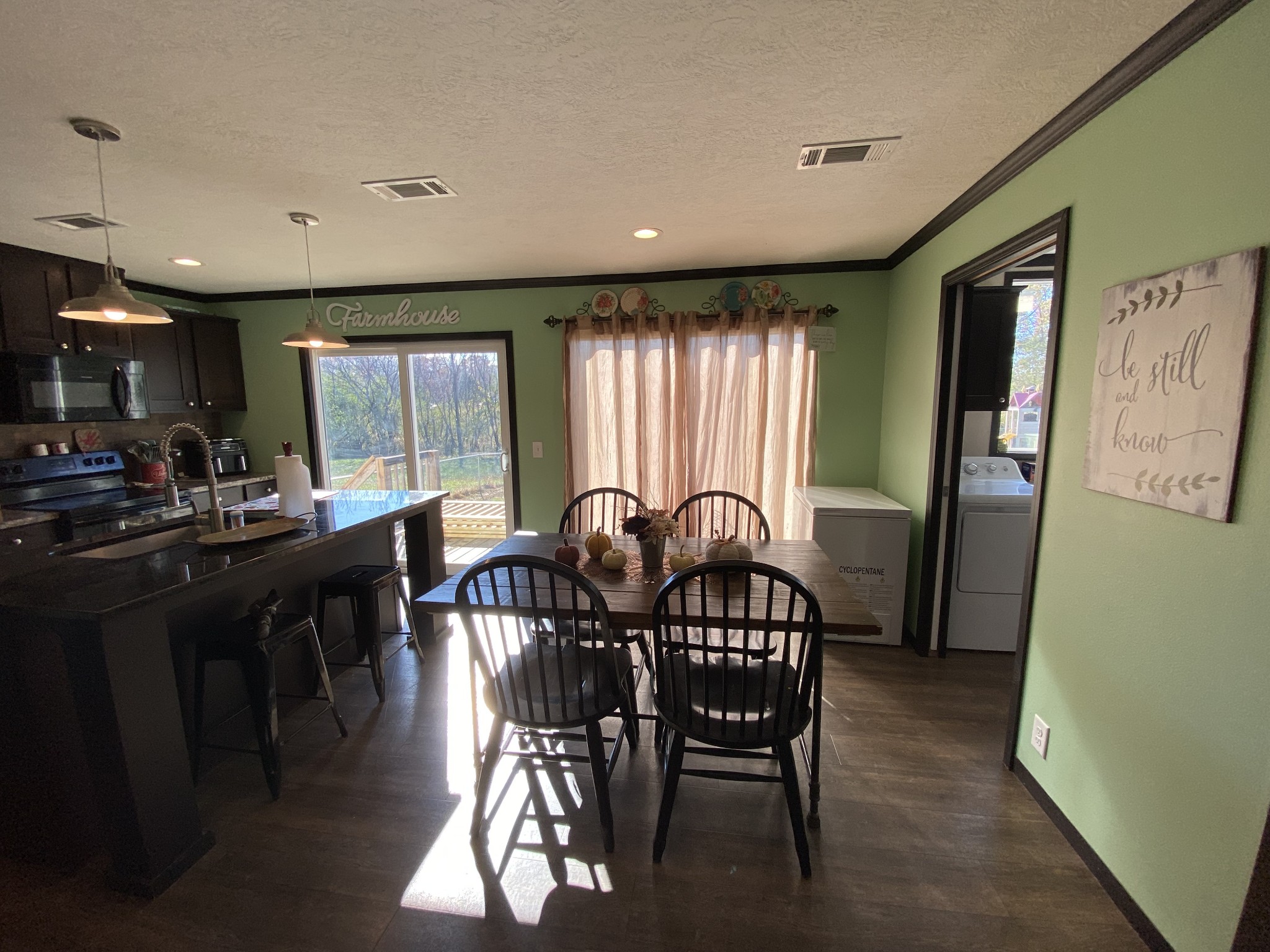 255 Rascal Town Road Loretto, TN 38469 - Photo 28 of 54 a view of a a dining room with furniture window and wooden floor