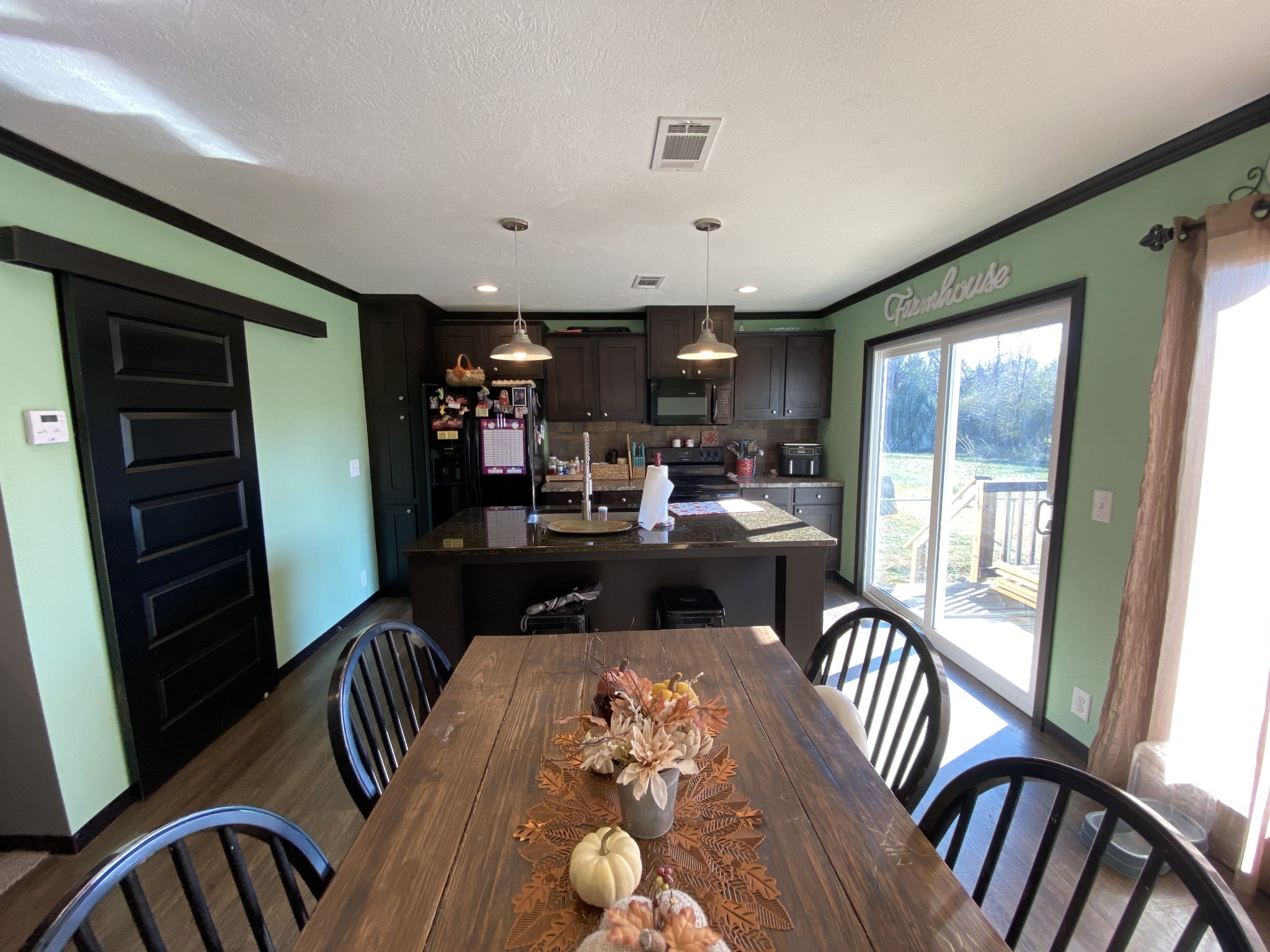 255 Rascal Town Road Loretto, TN 38469 - Photo 29 of 54 a view of a dining room with furniture window and wooden floor