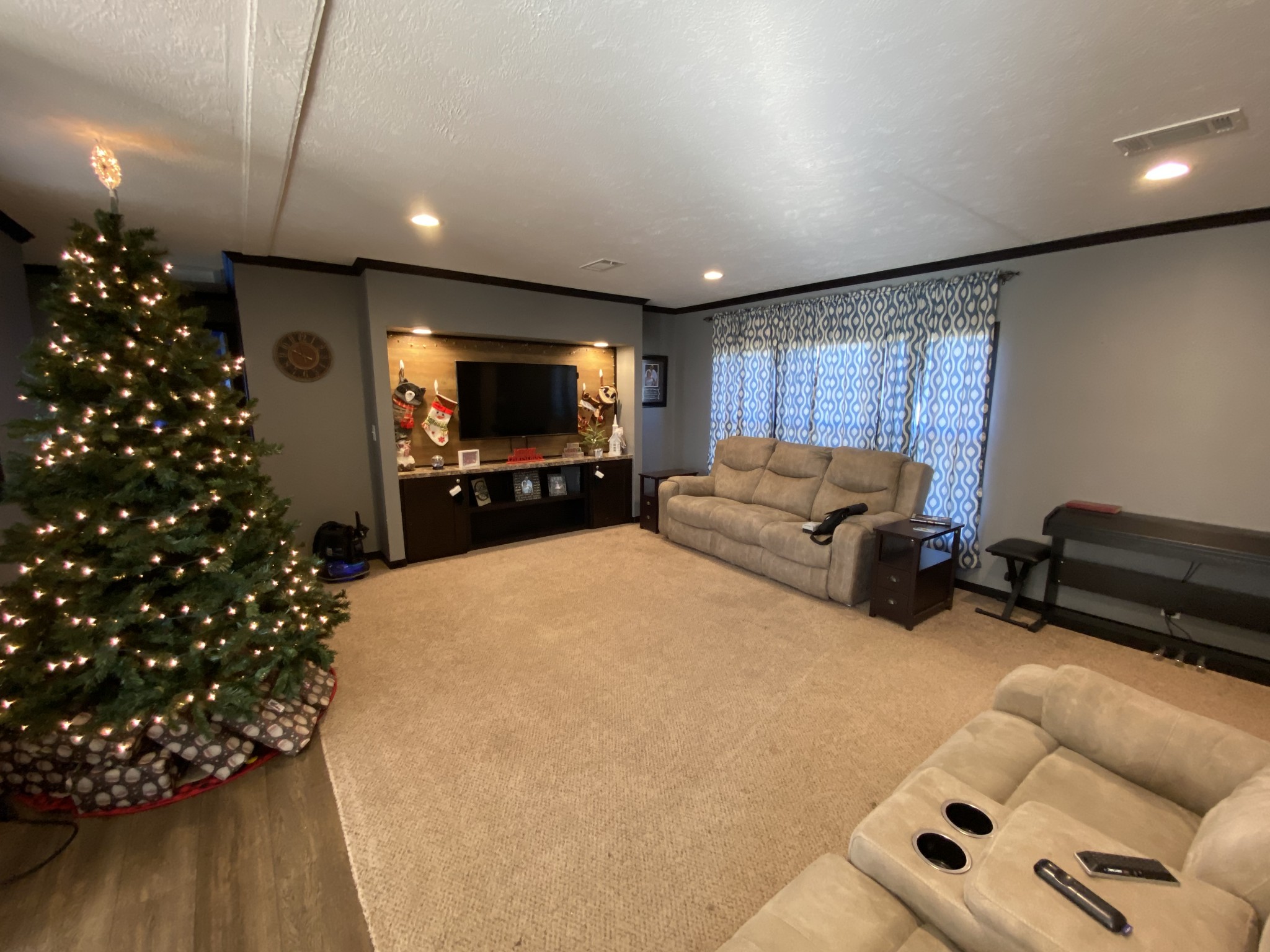 255 Rascal Town Road Loretto, TN 38469 - Photo 35 of 54 a living room with furniture a flat screen tv and a christmas tree