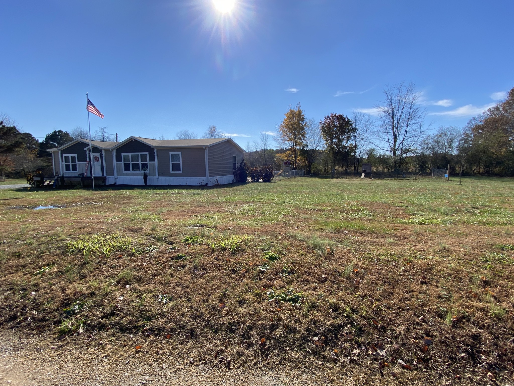 255 Rascal Town Road Loretto, TN 38469 - Photo 8 of 54 a view of a big house with a big yard and a large tree