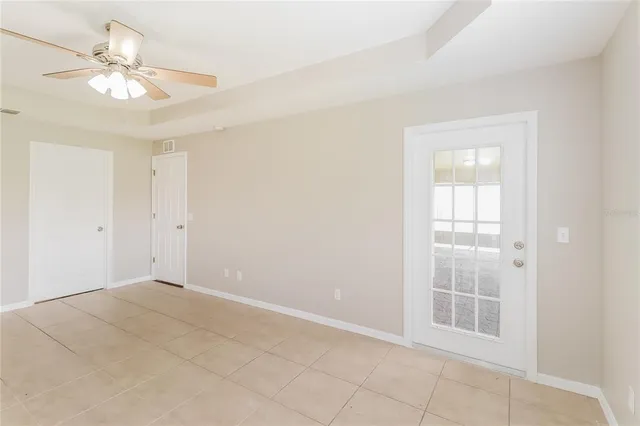 a en suite bathroom with a granite countertop sink and a mirror