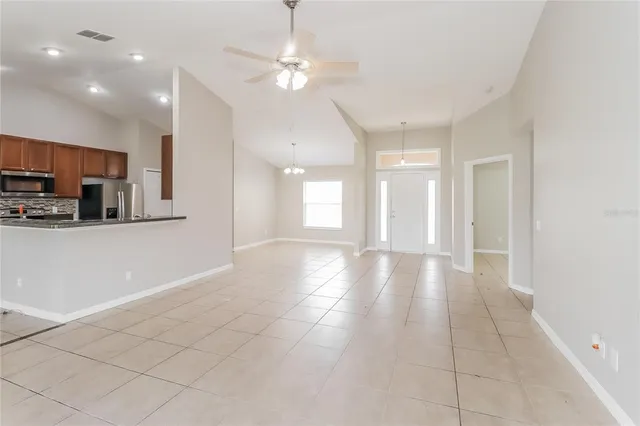a view of a kitchen with a sink and dishwasher a kitchen island