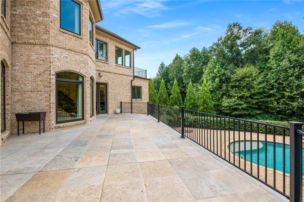 2340 Thisel Down Drive Statham, GA 30666 - Photo 102 of 105 a view of a brick house with a yard