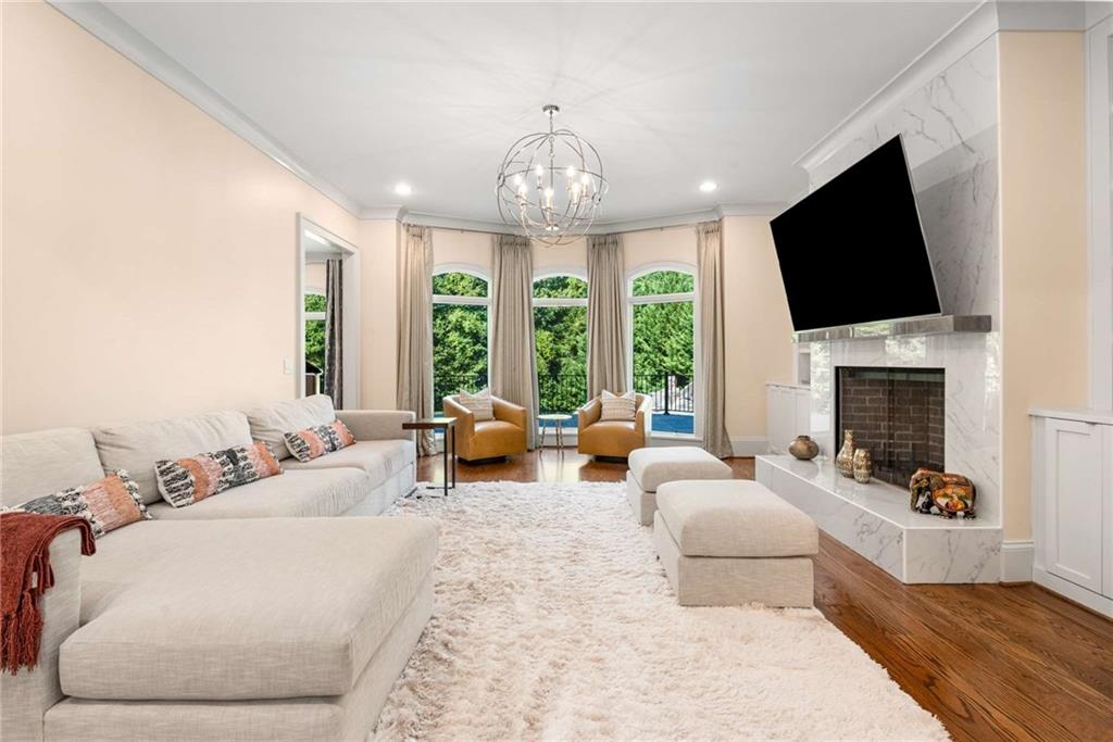 2340 Thisel Down Drive Statham, GA 30666 - Photo 13 of 105 a living room with furniture fireplace and flat screen tv