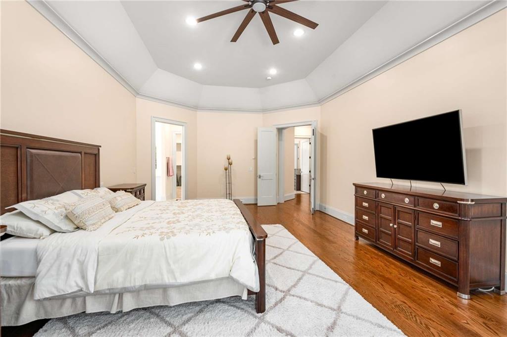 2340 Thisel Down Drive Statham, GA 30666 - Photo 18 of 105 a bedroom with a bed and a flat screen tv