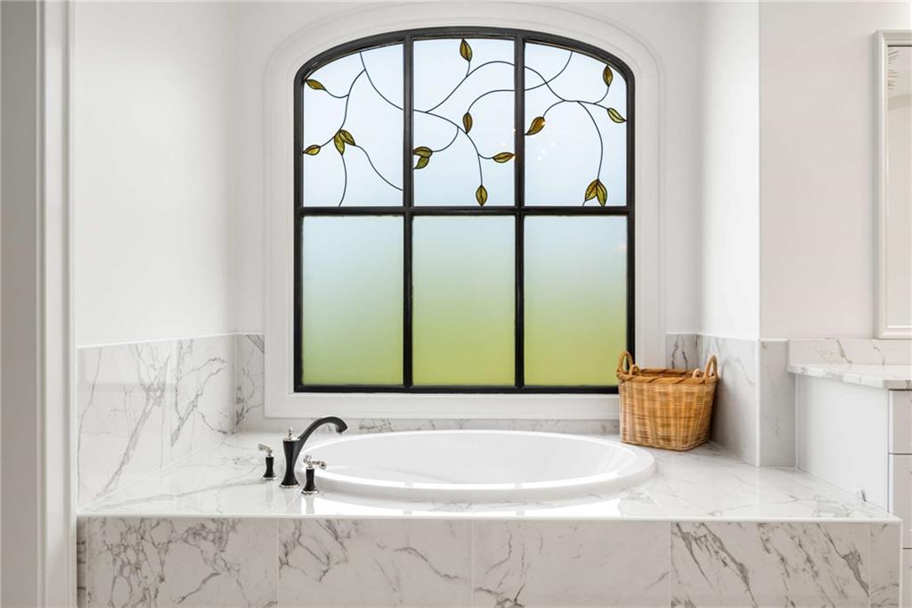 2340 Thisel Down Drive Statham, GA 30666 - Photo 24 of 105 a bathroom with a tub and a window