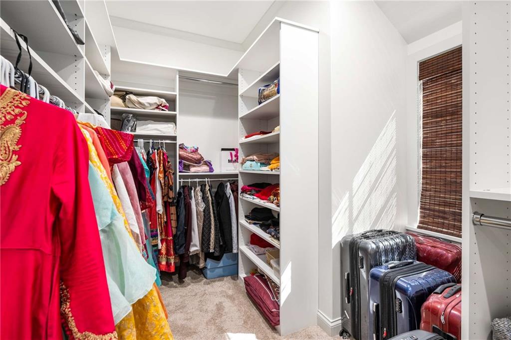 2340 Thisel Down Drive Statham, GA 30666 - Photo 27 of 105 a view of walk in closet with clothes and shoes