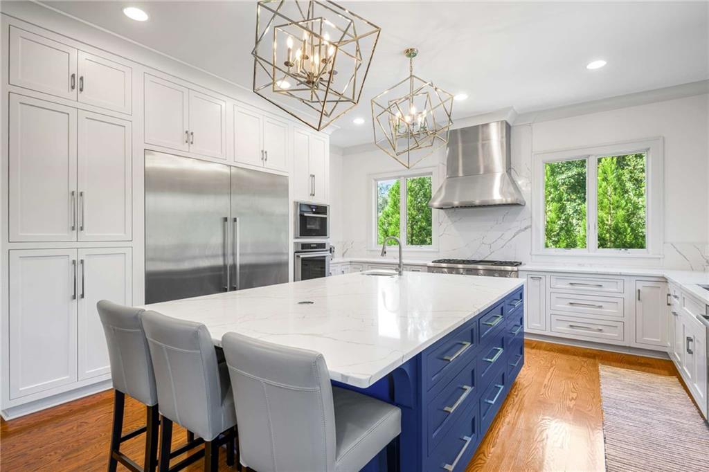 2340 Thisel Down Drive Statham, GA 30666 - Photo 38 of 105 a large kitchen with kitchen island a large island in it