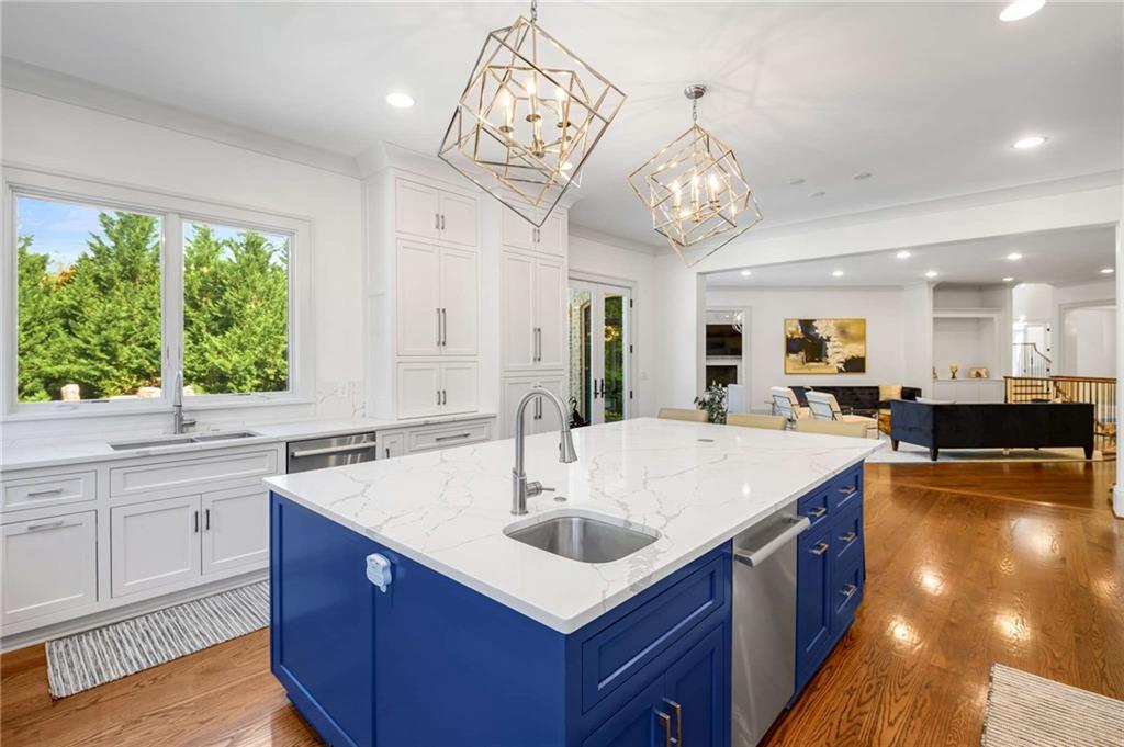 2340 Thisel Down Drive Statham, GA 30666 - Photo 42 of 105 a large kitchen with kitchen island a large island in it