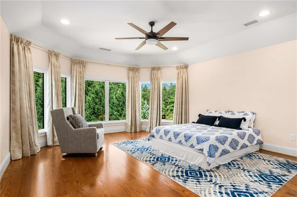 2340 Thisel Down Drive Statham, GA 30666 - Photo 48 of 105 a bedroom with a large bed and a couch