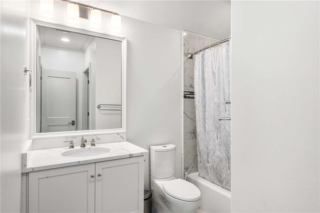 2340 Thisel Down Drive Statham, GA 30666 - Photo 51 of 105 a bathroom with a sink a toilet and shower