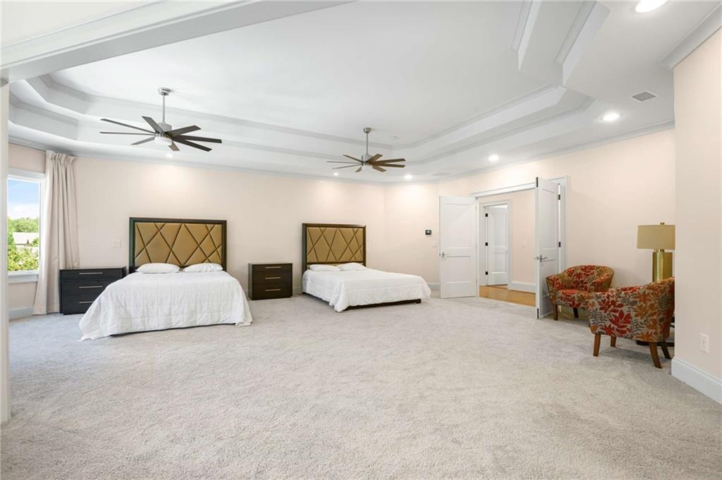 2340 Thisel Down Drive Statham, GA 30666 - Photo 58 of 105 a spacious bedroom with a bed and window