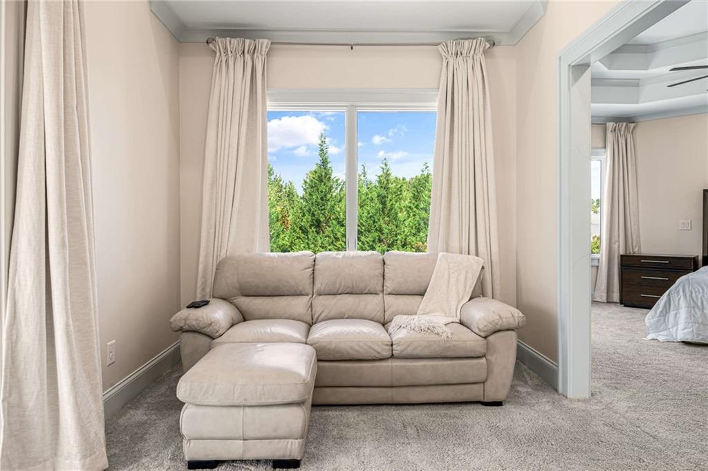 2340 Thisel Down Drive Statham, GA 30666 - Photo 60 of 105 a living room with furniture and a large window