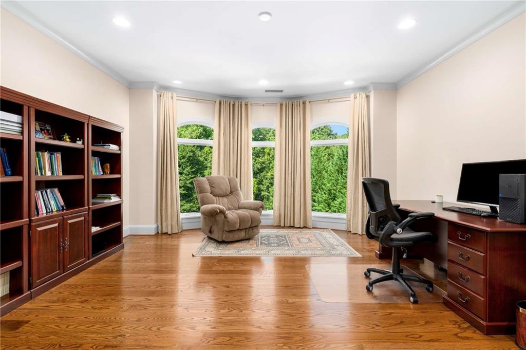 2340 Thisel Down Drive Statham, GA 30666 - Photo 6 of 105 a view of a livingroom with workspace and a window