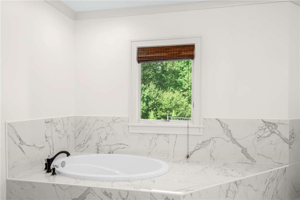 2340 Thisel Down Drive Statham, GA 30666 - Photo 63 of 105 a bathroom with a sink and a window