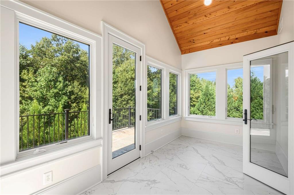2340 Thisel Down Drive Statham, GA 30666 - Photo 69 of 105 a view of an empty room with wooden floor and outdoor view