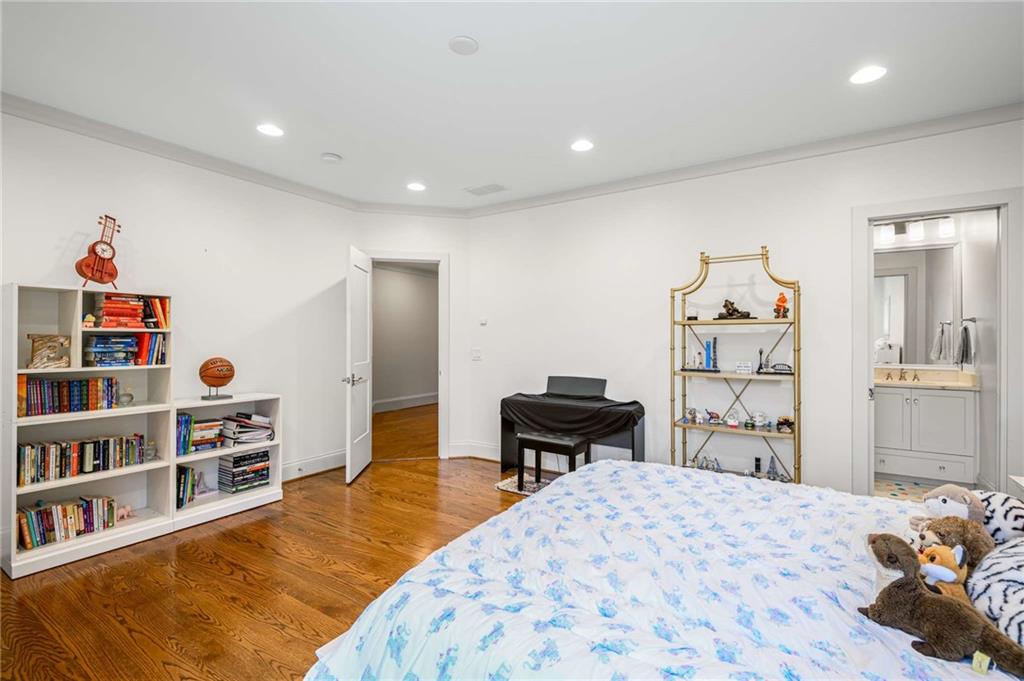 2340 Thisel Down Drive Statham, GA 30666 - Photo 72 of 105 a bedroom with a bed and a book shelf