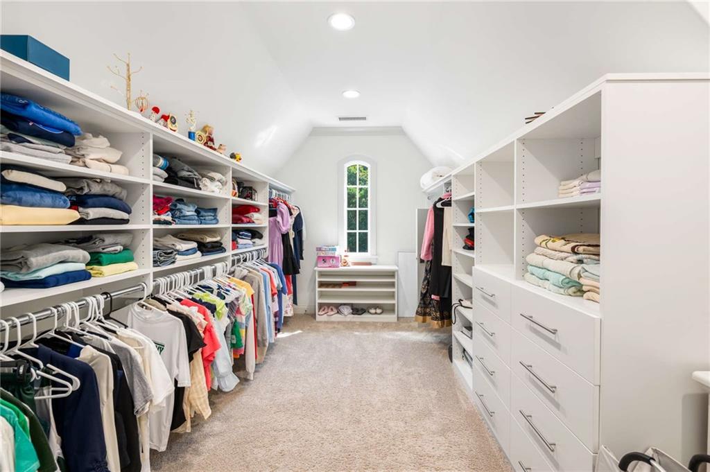 2340 Thisel Down Drive Statham, GA 30666 - Photo 74 of 105 a walk in closet with clothes and shoes