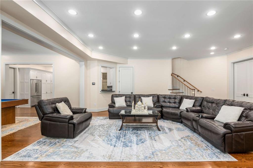 2340 Thisel Down Drive Statham, GA 30666 - Photo 79 of 105 a living room with furniture and wooden floor