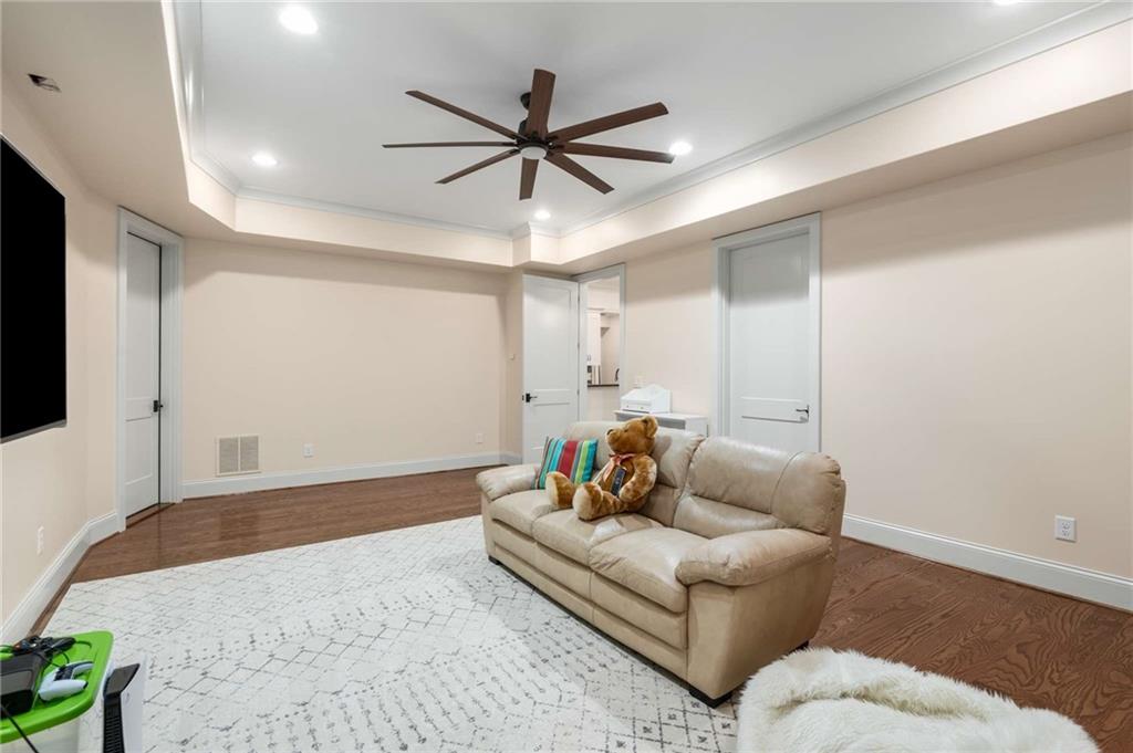 2340 Thisel Down Drive Statham, GA 30666 - Photo 86 of 105 a living room with furniture and a ceiling fan
