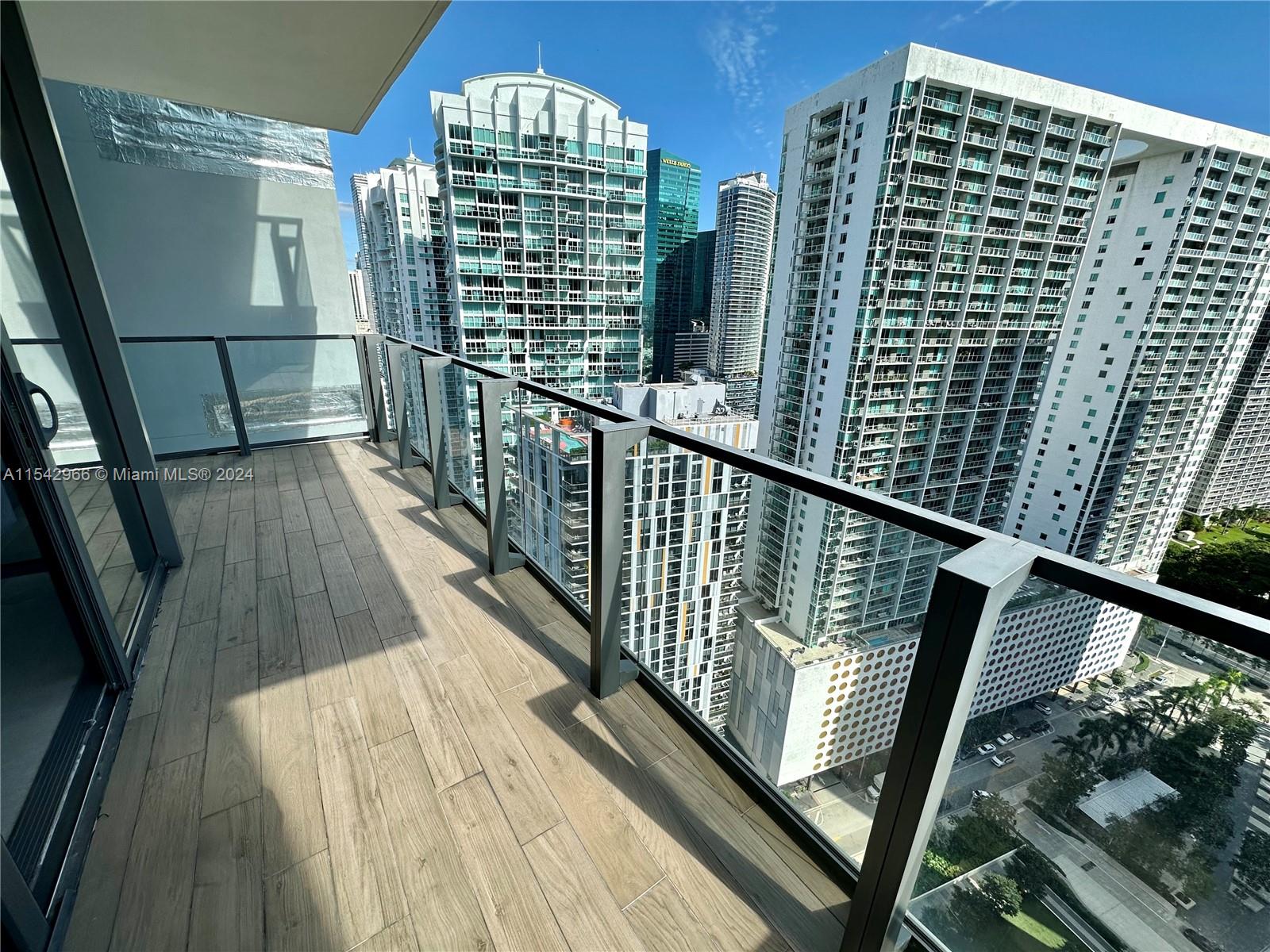 68 Southeast 6th Street, Unit 2707 Miami, FL 33131 - Photo 32 of 53 a view of balcony with wooden floor