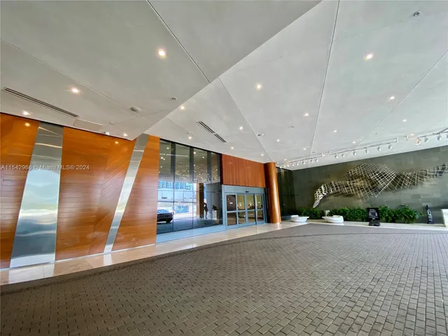 a gym room with lots of furniture and clutter