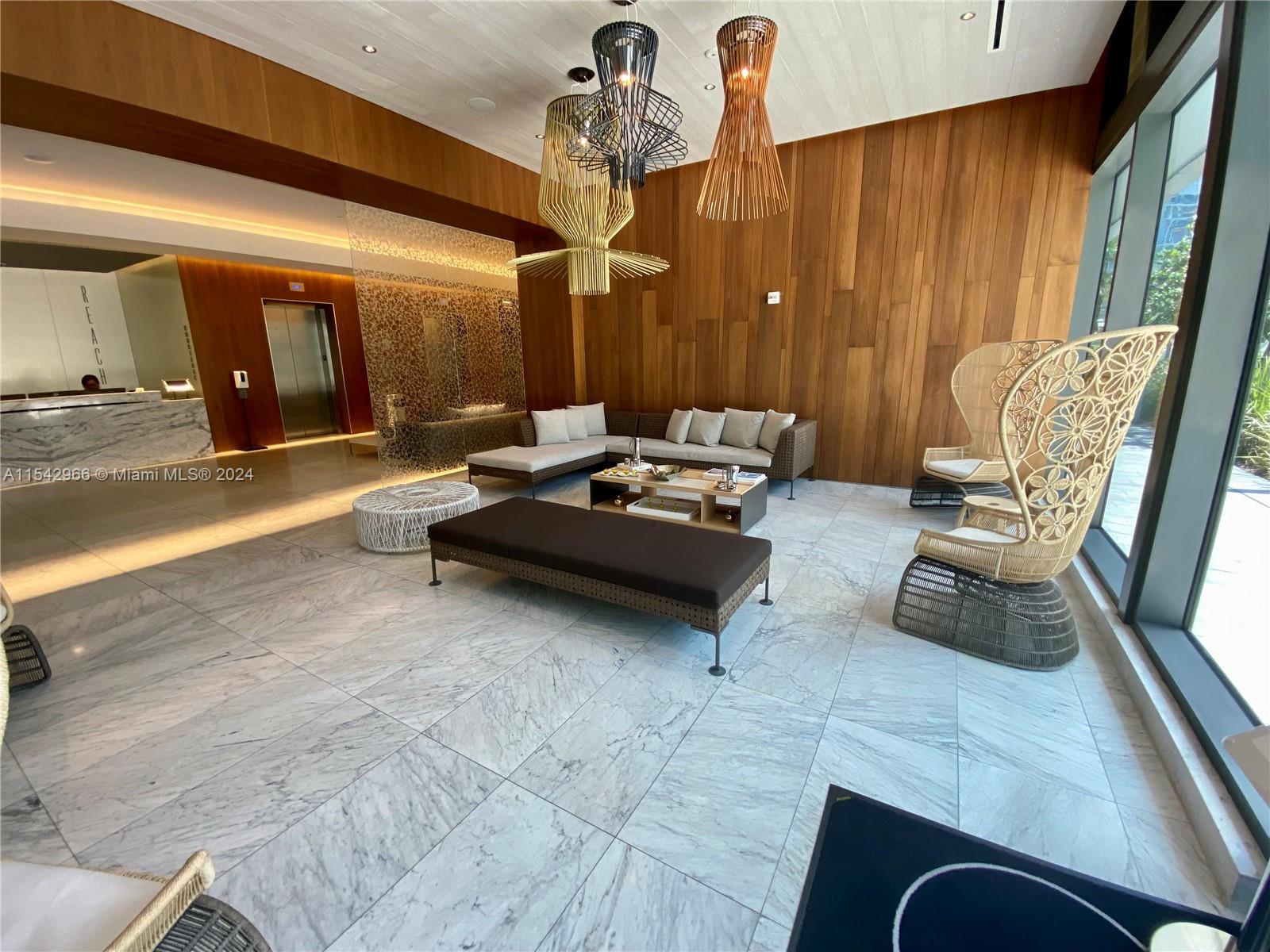 68 Southeast 6th Street, Unit 2707 Miami, FL 33131 - Photo 36 of 53 a living room with furniture and a window