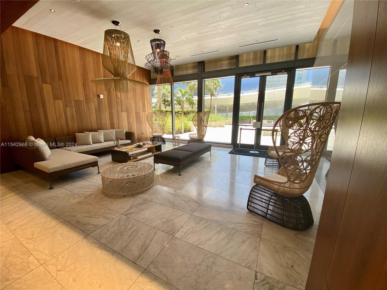 68 Southeast 6th Street, Unit 2707 Miami, FL 33131 - Photo 37 of 53 a living room with patio furniture